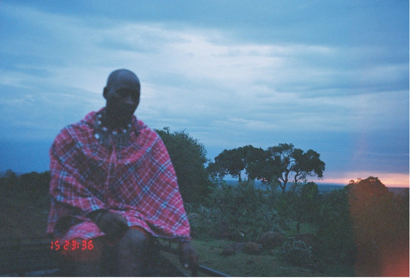 A Kenyan man on the plains of the Mara Triangle in Kenya