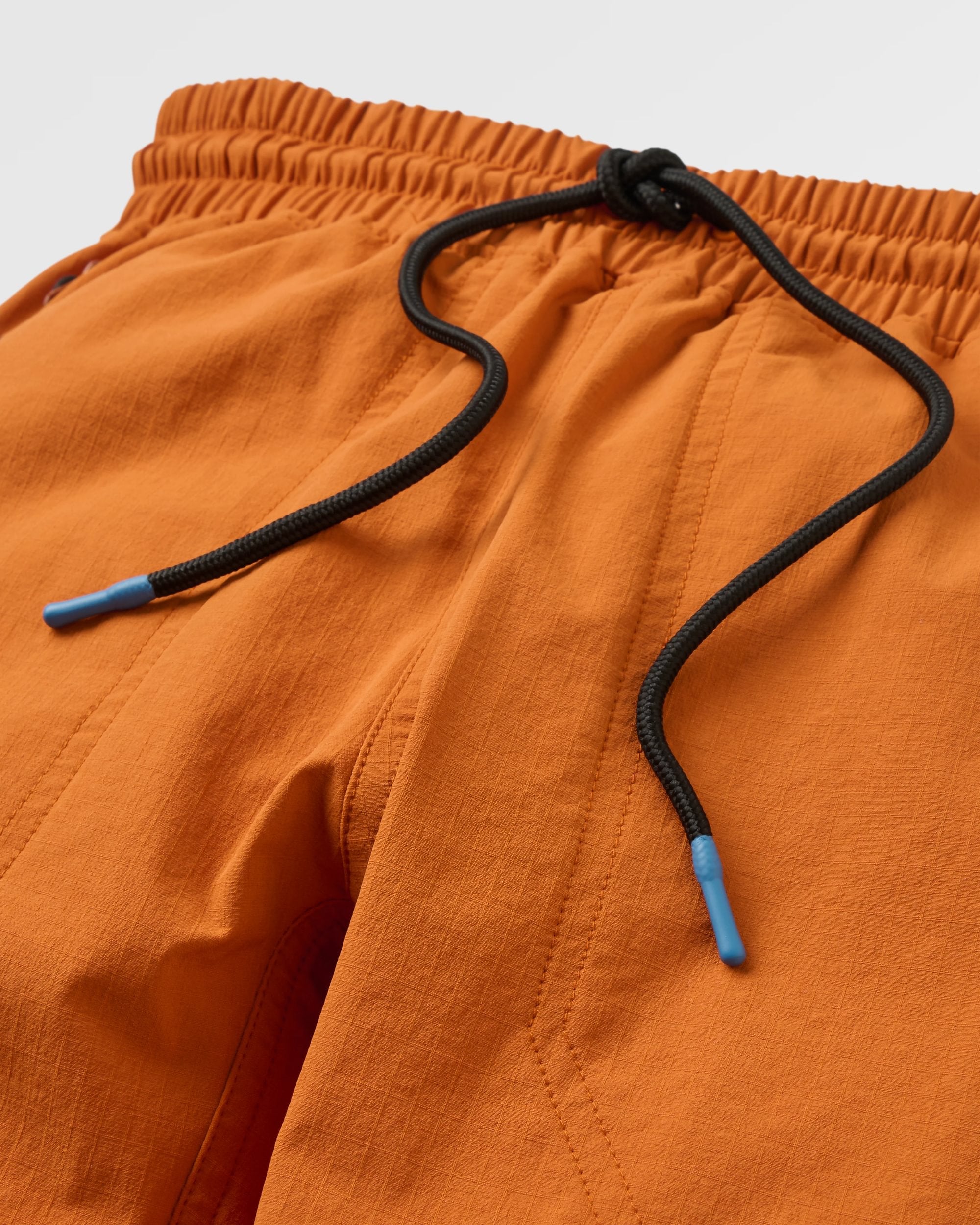 Sandstone Recycled Active Trail Jogger - Sunset Orange - Flatlay