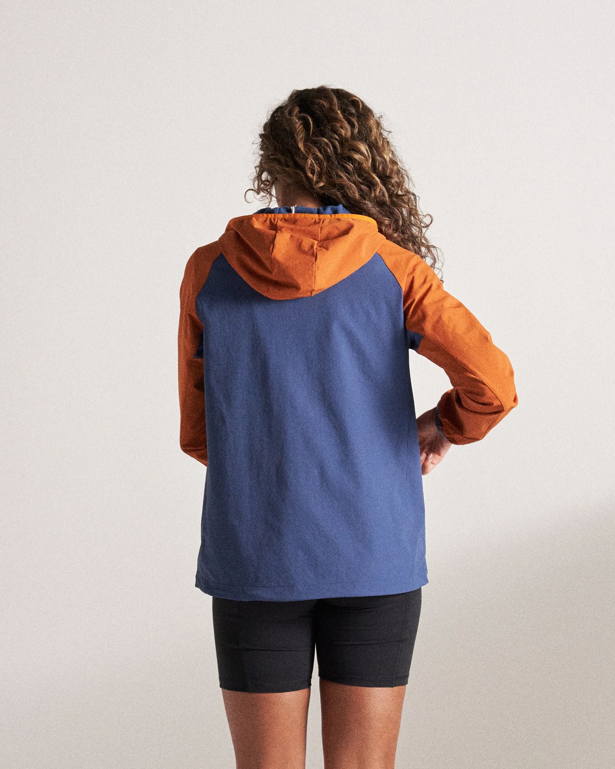 Ocean Light Recycled Softshell Anorak - Dark Denim/Sunset Orange - Studio Model